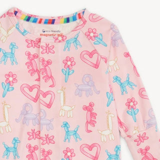 Magnetic Me pink coverall for baby girls with magnetic closure and balloon animal print.