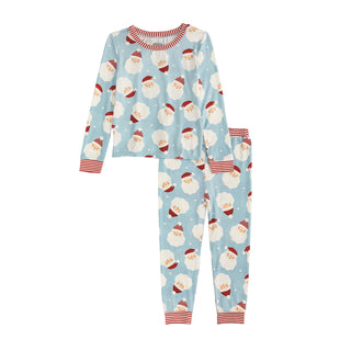 Blue glow-in-the-dark Santa pajamas by Mud Pie with bamboo knit fabric, striped cuffs, and festive holiday charm for boys and girls.