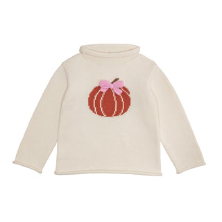 Ivory girls’ rollneck sweater with pumpkin intarsia and pink bow—perfect for fall photos, pumpkin patches, and Thanksgiving gatherings.