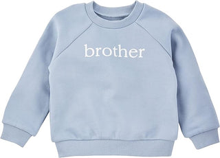Blue French terry sweatshirt with bold “BROTHER” text, ribbed trim, and cozy fit—perfect gift for boys or sibling photo shoots.