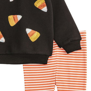 Girls Halloween outfit set with sequin candy corn sweatshirt and orange striped leggings—perfect for fall fun and class parties.