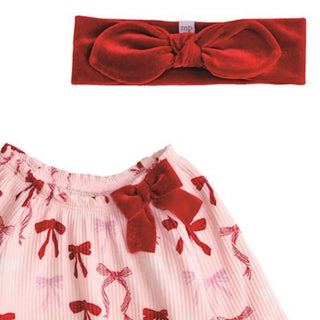 Pink baby sleeper with red and pink bow print, velour bow accent, and matching headband—perfect for baby girl’s first Christmas.