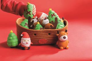 Mud Pie Christmas squeeze toys for kids—Santa, reindeer, and tree characters designed for festive sensory fun and stress relief.