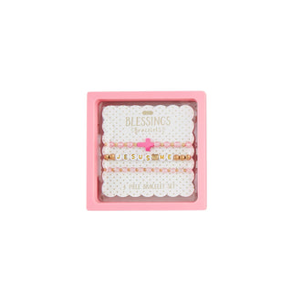 Set of 3 Mud Pie cross beaded bracelets in pink or white—faith-inspired stretch jewelry for girls and gift-giving occasions.