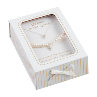 Jewelry set with necklace and bracelet in a decorative box on a white background