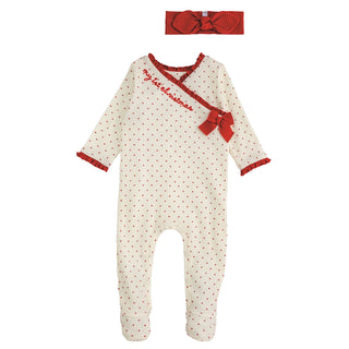 Ivory baby sleeper with red dots, ruffle trim, and bow, paired with matching headband—perfect for baby girl’s first Christmas.