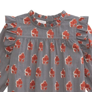 Baby girl long-sleeve floral romper with ruffle trim in warm fall tones—made from soft cotton voile with snap legs for easy diaper changes.