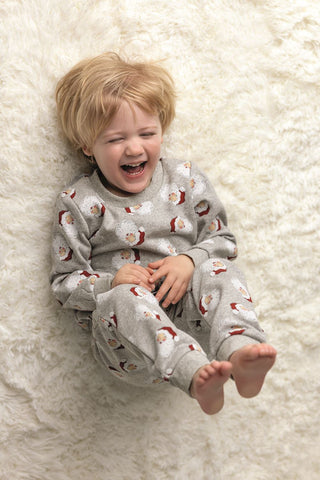Mud Pie gray sweatshirt and jogger set for kids with all-over Santa print—cozy French terry fabric for holiday lounging and play.