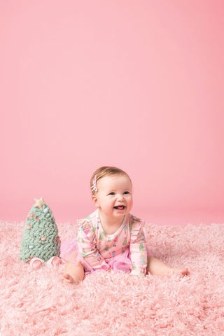 Pink Nutcracker tutu crawler with ruffled sleeves and mesh skirt—perfect for baby's first Christmas or holiday photos.