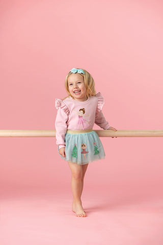 Blue Nutcracker tutu with sequin ballerinas, Christmas trees, and gold waistband—perfect for holiday parties and festive dress-up fun.