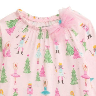 Pink bamboo baby sleeper with Nutcracker print and mesh bow—soft, festive, and footed for cozy holiday nights.
