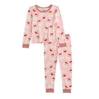 Pink Santa pajamas with glow-in-the-dark print by Mud Pie, made of soft bamboo knit with striped cuffs—perfect for holiday bedtime fun.