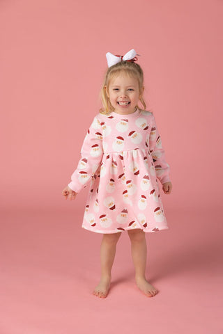 Pink Santa-print sweatshirt dress for girls with long sleeves, twirl skirt, and cozy French terry—perfect for holiday fun and comfort.