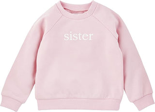 Pink Mud Pie sweatshirt for girls with “sister” embroidery on front, made of soft French terry and finished with ribbed trim.