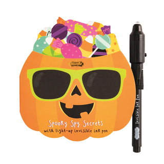 Halloween invisible ink pads with light-up pens—fun themed notebooks from Mud Pie in monster, pumpkin, and skeleton styles.