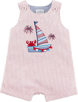 Mud Pie Sailboat Jon Jon with patriotic sailboat applique, red stripe seersucker fabric, cuffed legs, and covered shoulder buttons.