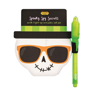 Halloween invisible ink pads with light-up pens—fun themed notebooks from Mud Pie in monster, pumpkin, and skeleton styles.