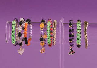 Set of 3 Mud Pie Halloween beaded bracelets—glow-in-the-dark stretch sets in Haunted, Hey Boo, or Spooky designs.