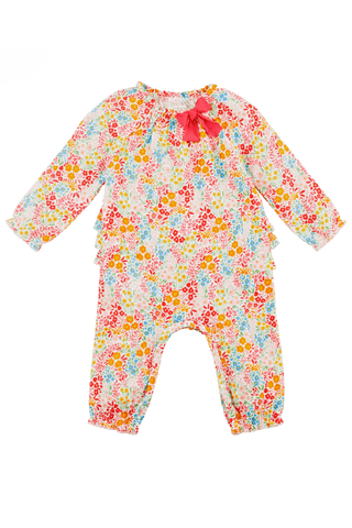 Bright floral one-piece for girls by Mud Pie, featuring a pink background, colorful flowers, ruffles, and a red bow detail.
