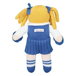 Back view of blue and white knit cheerleader plush doll with yellow yarn pigtails, pleated skirt, and soft baby gift toy