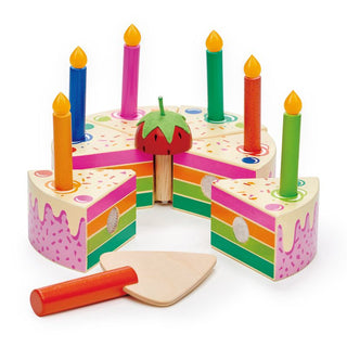 Wooden birthday cake toy with rainbow slices, candles, and slicer—perfect for pretend play and learning through celebration.
