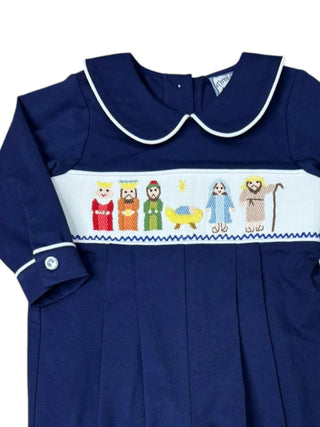 Navy blue boys bubble romper with colorful embroidered nativity design with baby Jesus, holy family, and wisemen on navy.