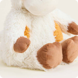 Sitting Warmies Pumpkin Spice Cow plush toy, perfect for snuggling, warming, or cooling therapy with relaxing lavender scent.