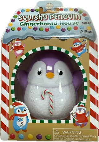 Purple penguin squishy toy with red and green striped candy cane, holiday collectible squishy toy in decorative packaging.