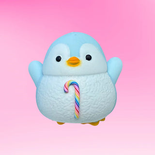 Blue penguin squishy sensory toy with rainbow candy cane treat perfect as stocking stuffers and collectible toys to trade.