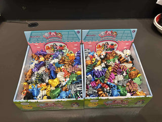 Display box of Zorbitz Twiddle-Itz metallic animal fidget toys in various colors and animal designs for collecting and trading.