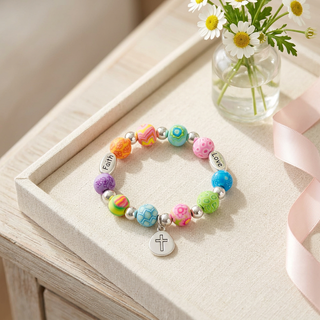 Bracelet styled on a linen tray with soft floral accents